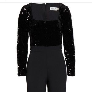 Eliza J black jumpsuit- sequin top, black trousers bottom, and packets